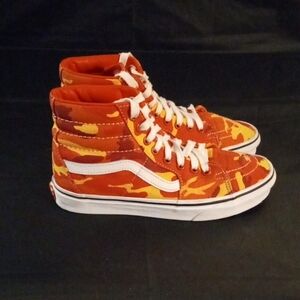 Vans Sk8-Hi high-top Unisex sneaker in an orange and yellow camouflage .